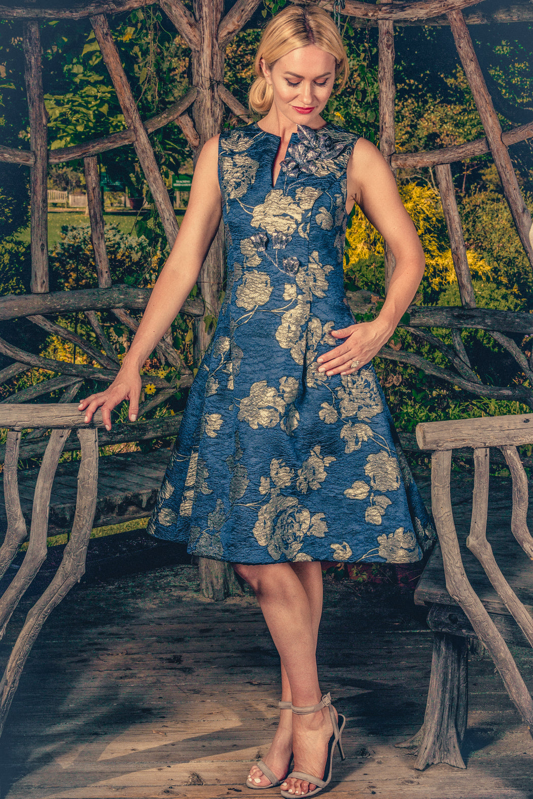 anna nieman designer dress Boston. A dress made from Swiss metallic brocade, with a fit-and-flare silhouette, has the comfort of weightless fabric with three-dimensional silvery / navy pattern.