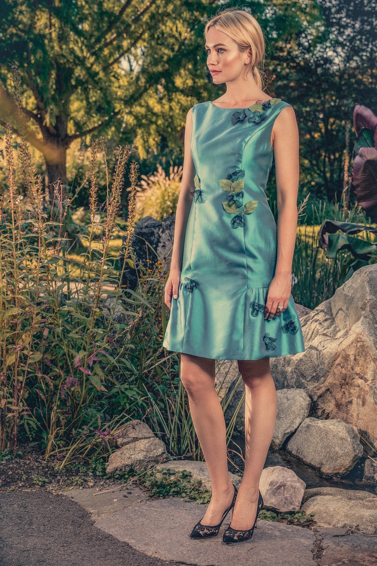 anna nieman designer dress Boston. A little turquoise dress, embroidered with black french tulle, and green leaves.