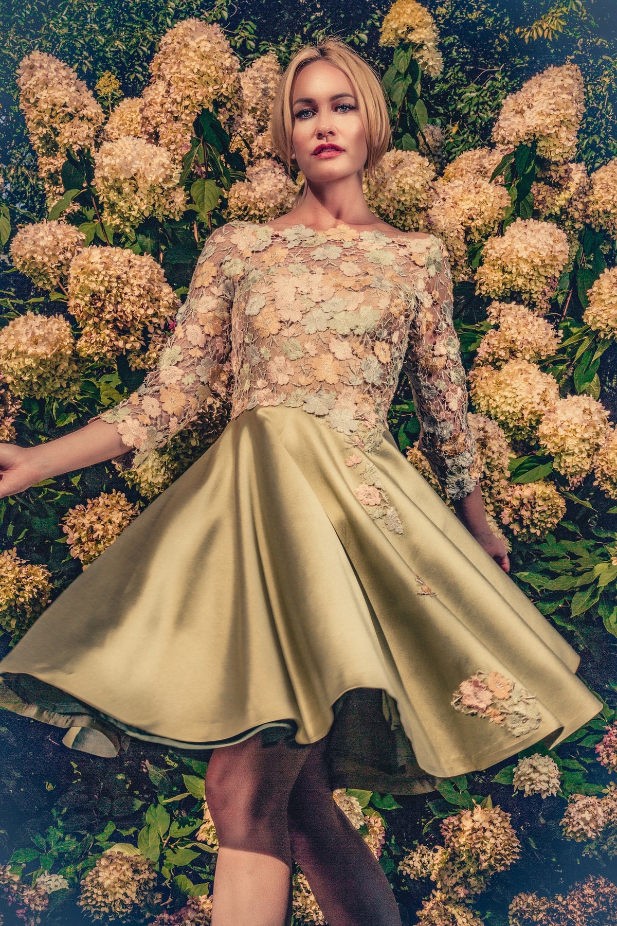 anna nieman designer dress Boston. A swirl dress made from silvery-goldish french Guipure lace. You will blend in perfect unison with the flowers during your garden party.